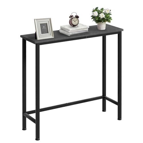 An entryway console table with decor and a mirror