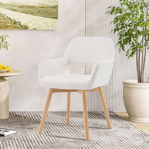 A cozy reading corner with a chair, lamp, and plants