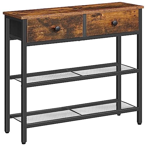 An entryway console table with decor and a mirror