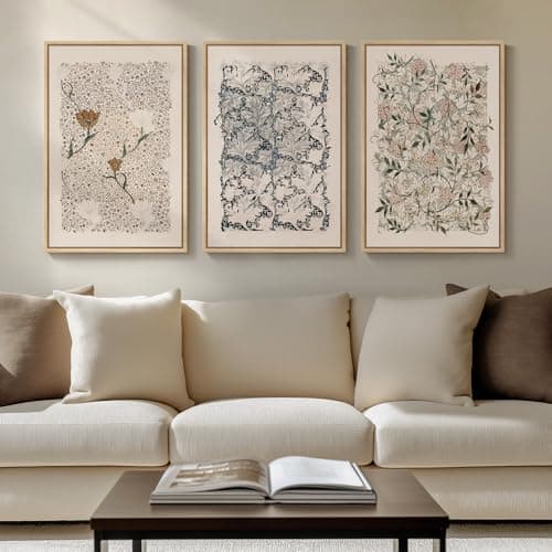 A gallery wall of framed art above a sofa