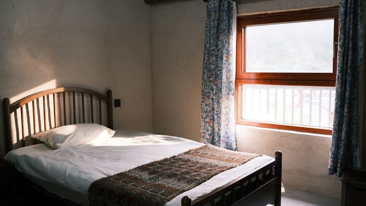 Linen curtains framing a sunlit window