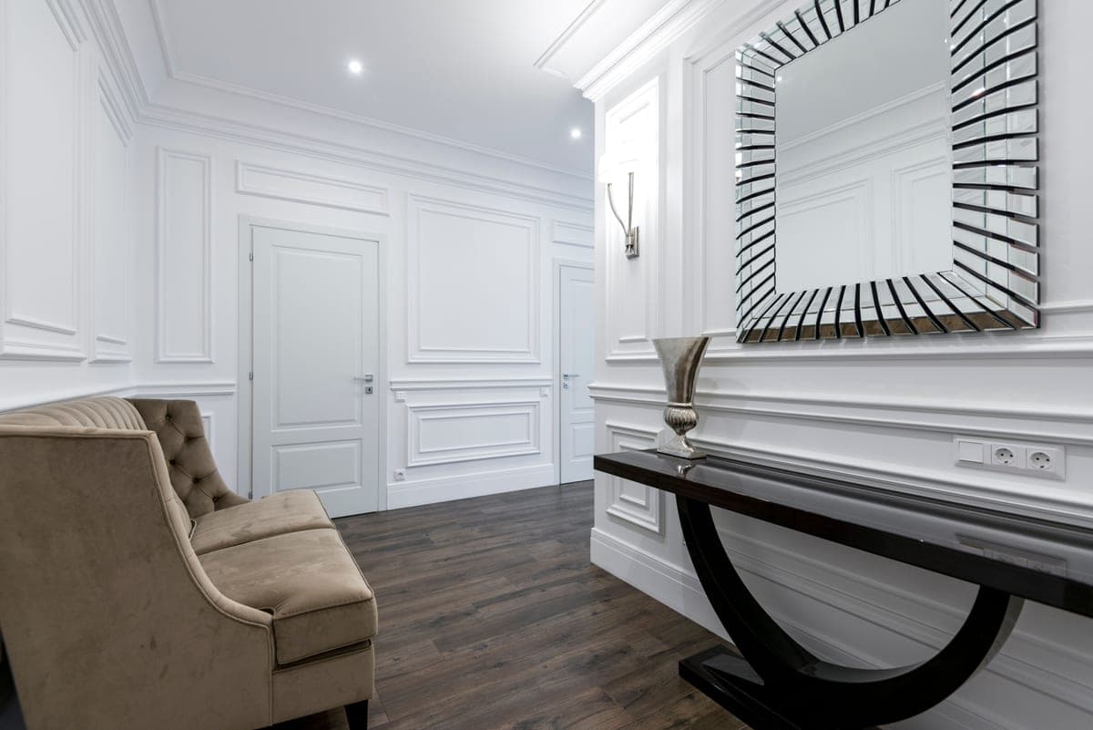 A welcoming entryway with a console and mirror