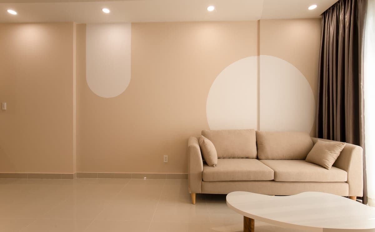 A modern sofa in a warm neutral living room