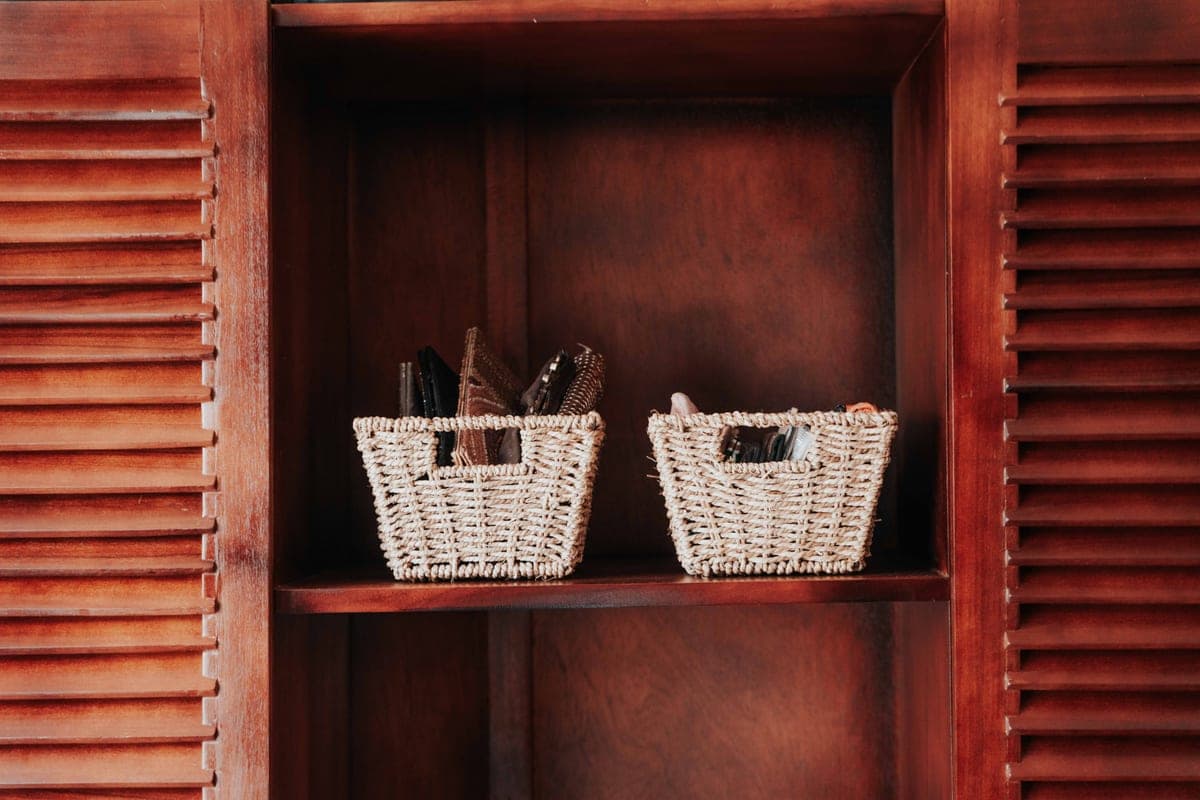 Woven storage baskets on an organized shelf