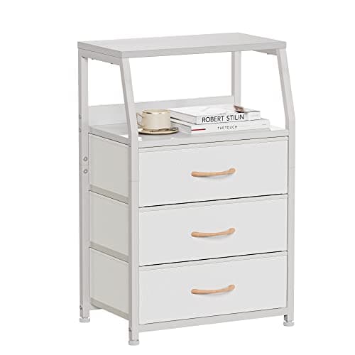 A nightstand with a bedside lamp and decor