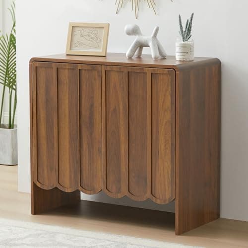 A wood dresser styled in a bedroom