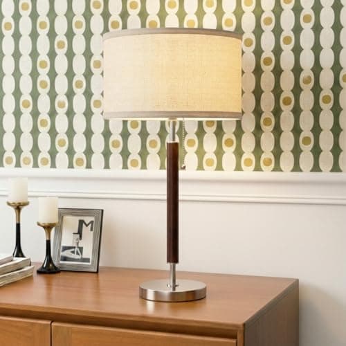 A table lamp casting warm light on a side table