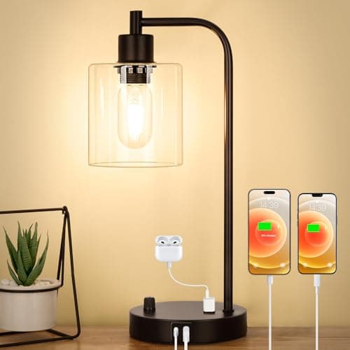 A table lamp casting warm light on a side table