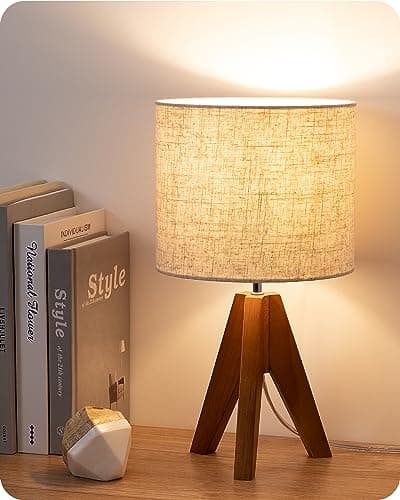 A table lamp casting warm light on a side table