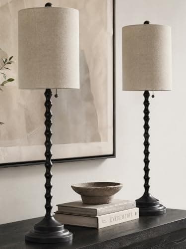 A table lamp casting warm light on a side table