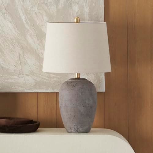 A table lamp casting warm light on a side table