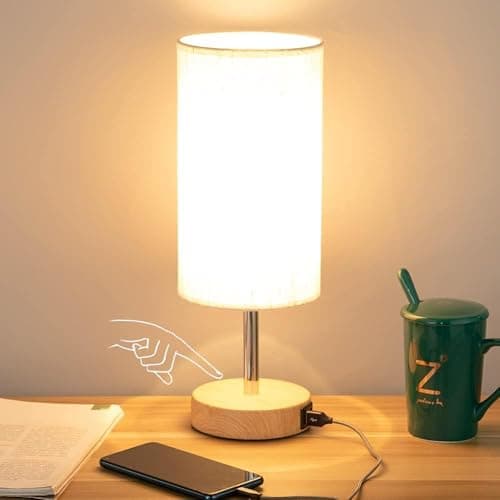 A table lamp casting warm light on a side table