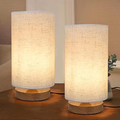A table lamp casting warm light on a side table