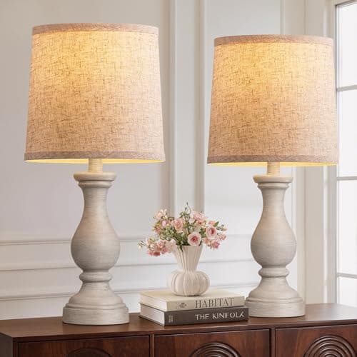 A table lamp casting warm light on a side table
