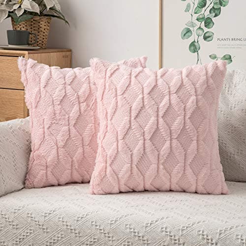 Textured throw pillows arranged on a sofa